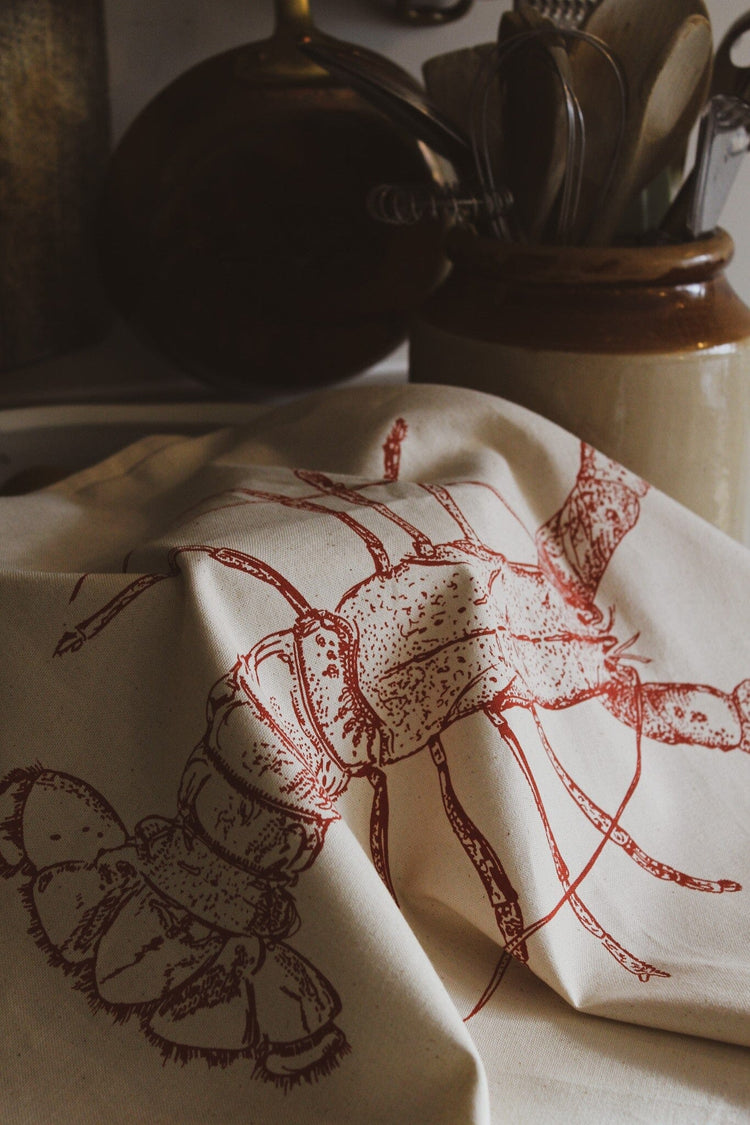 Seafood tea towels by Lottie Day featuring handprinted lobster and mussel designs – inspired by Norfolk’s fresh coastal catch