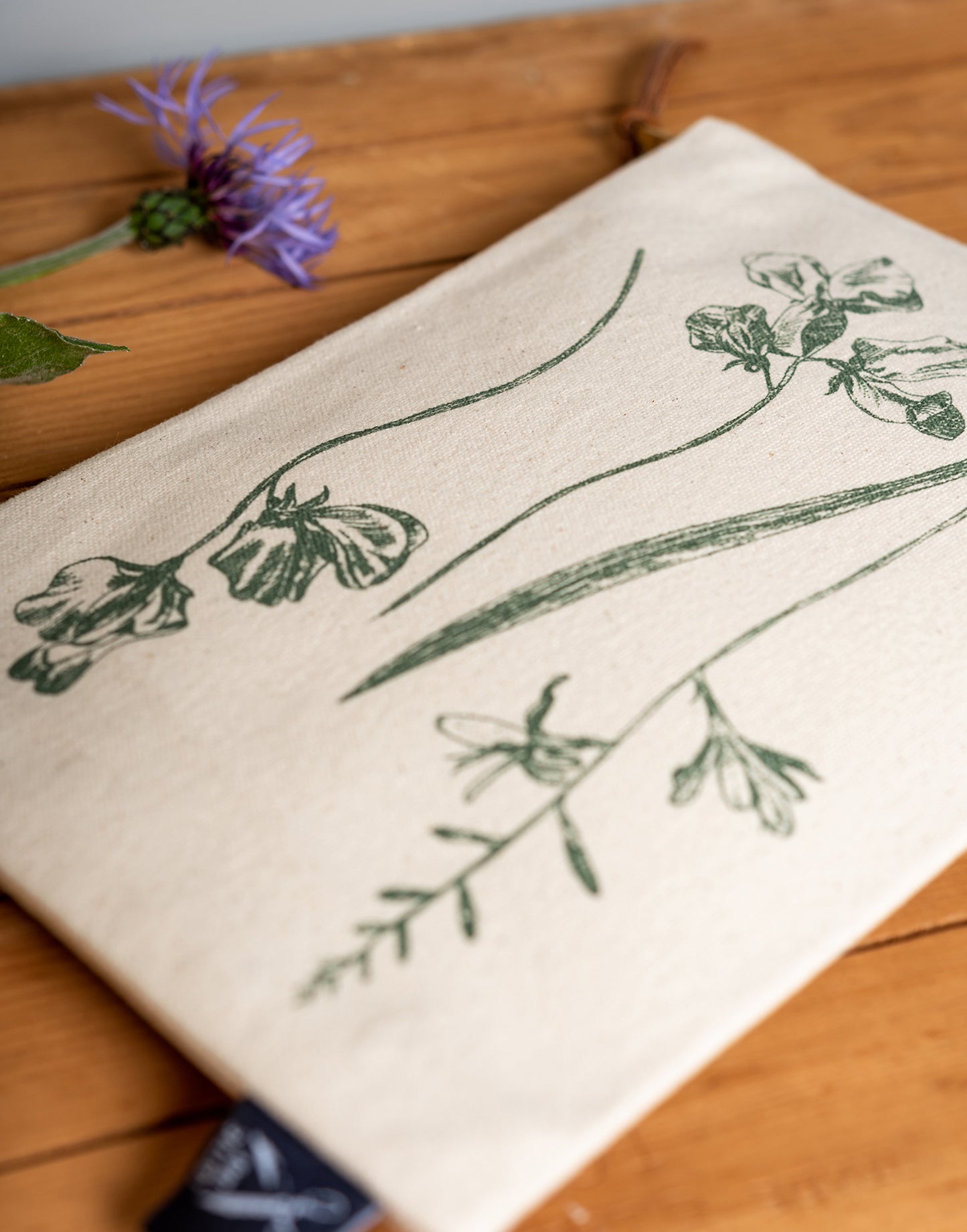 Garden flowers zipper pouch by Lottie Day – handmade cotton canvas bag with floral screen-printed design, inspired by Norfolk gardens