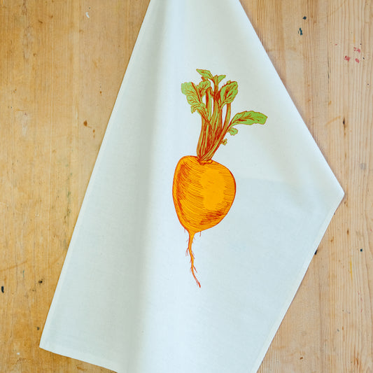 Orange Swede tea towel by Lottie Day – handmade cotton dish towel featuring root vegetable illustration, inspired by Norfolk allotments