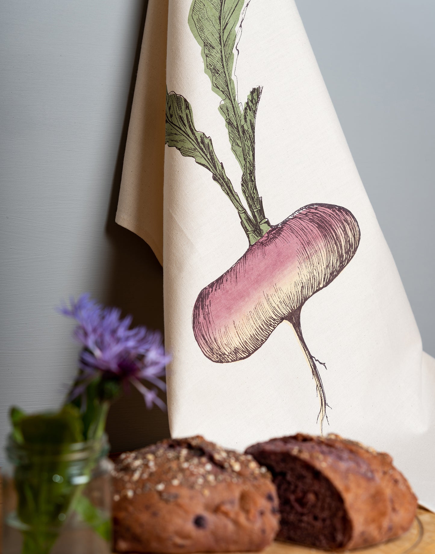 Purple Turnip tea towel by Lottie Day – hand-printed cotton kitchen towel with allotment-inspired root vegetable illustration